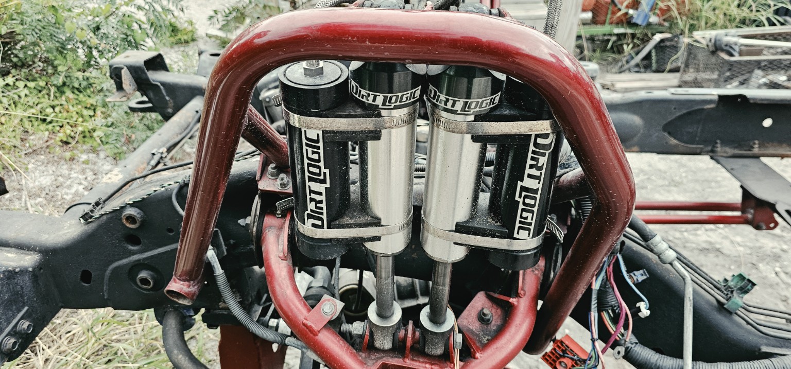 Dirt Logic dual front shocks and reservoirs
